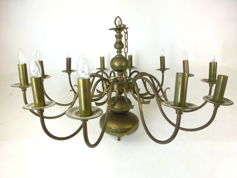 A pair of late 19th century brass twelve arm chandeliers. h. 68 cm, dia.