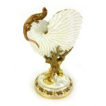 A 19th century Royal Worcester 'Nautilus' shell vase surmounted by a lizard,