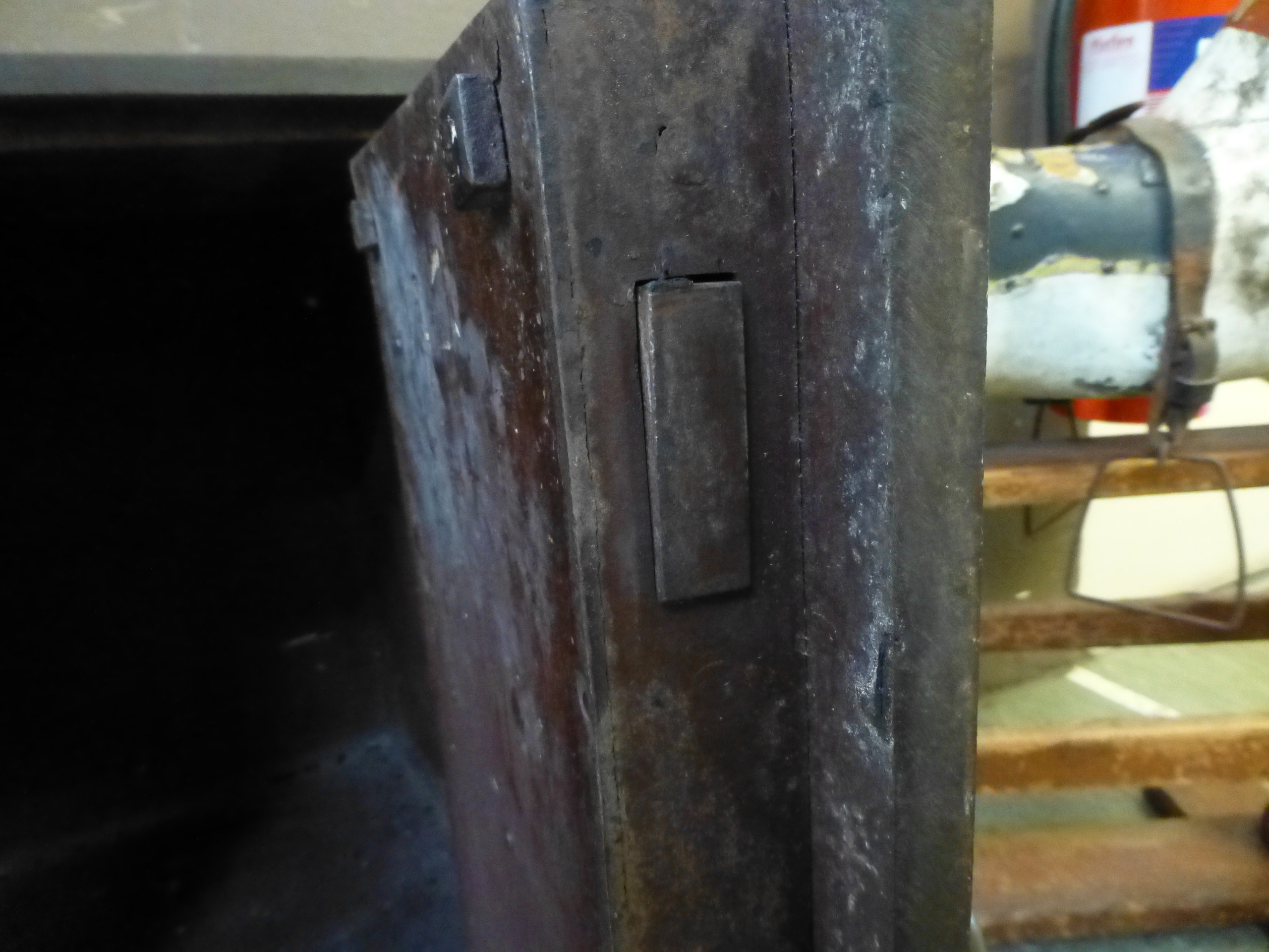 A 19th century cast iron safe on associated wooden base with hidden lock feature, safe h. 51 cm, w. - Image 6 of 6