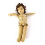 A mid-20th century fabric body and stuffed doll, with brown curled hair and painted brown eyes,