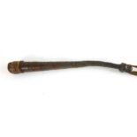 A leather bound African style cudgel,