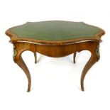A 19th century French king wood and burr walnut brass mounted writing table the serpentine top with
