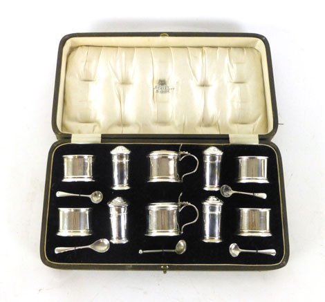 A presentation cased set of salts, pepper and mustard pots, Birmingham 1929, silver weight approx.
