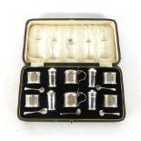 A presentation cased set of salts, pepper and mustard pots, Birmingham 1929, silver weight approx.