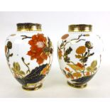 A pair of 19th century Royal Crown Derby vases, decorated in a floral Imari pattern,