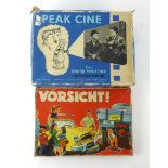 A boxed German board game 'Vorsicht' together with a boxed Peak Cine 8mm junior projector (2)
