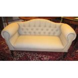 SOFA, in cream upholstery with button back on turned supports, 140cm W.