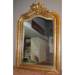 WALL MIRROR, late 19th century French gilt framed with cartouche crest and arched plate,