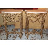 CONSOLE TABLES, a pair, Louis XVI style gilt framed with serpentine white marble tops,