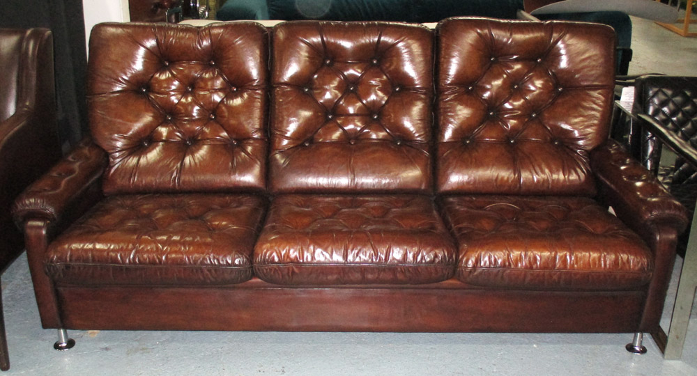 SOFA, 1970's brown leather with three cushion back and seat and outswept chrome supports, 195cm W.