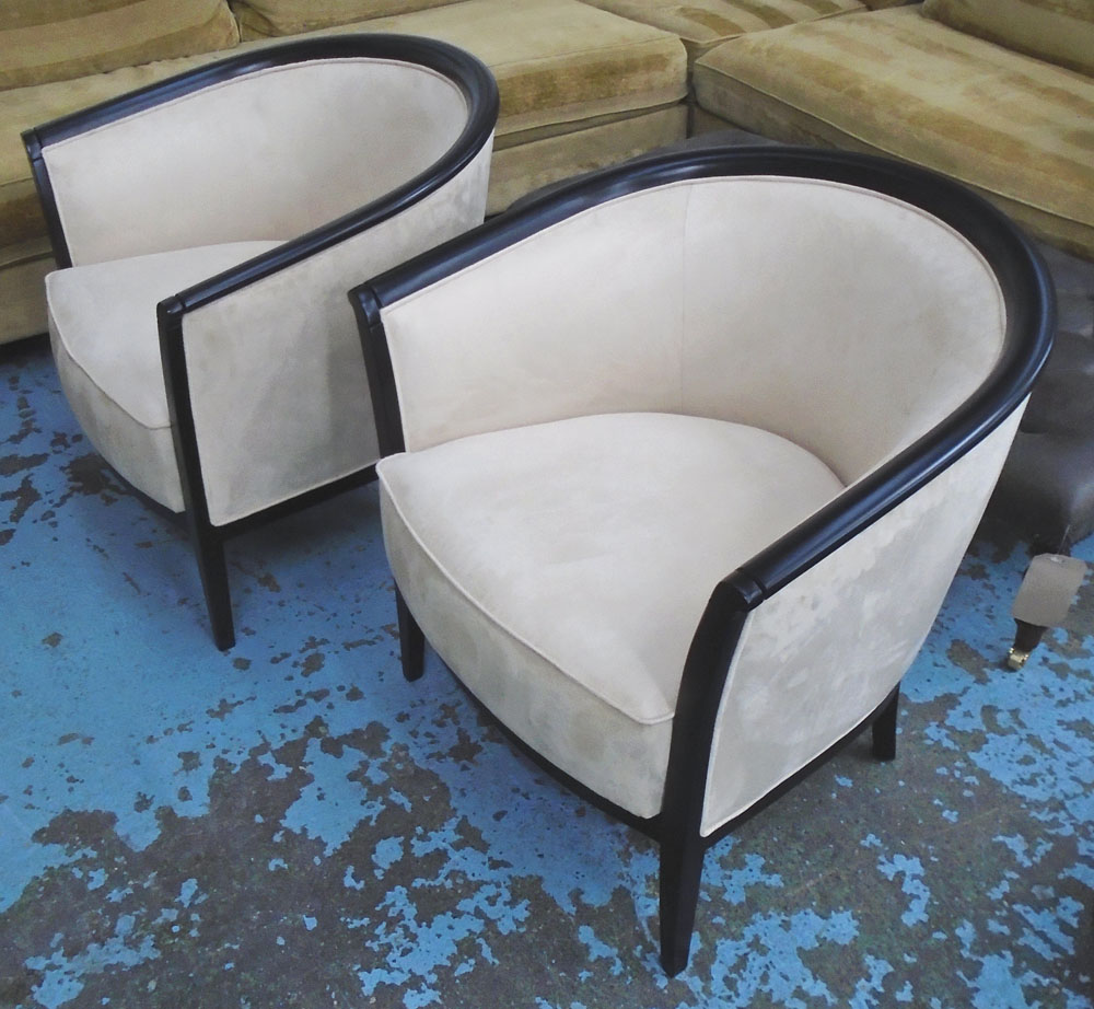 TUB CHAIRS, a pair, in cream suede on an ebonised frame, 73cm W.