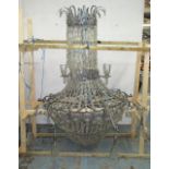CHANDELIER, of substantial proportions, in the form of recycled glass bottle parts,