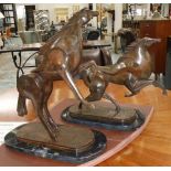 PRANCING HORSES, a pair, contemporary style on marble base, tallest 44cm H.