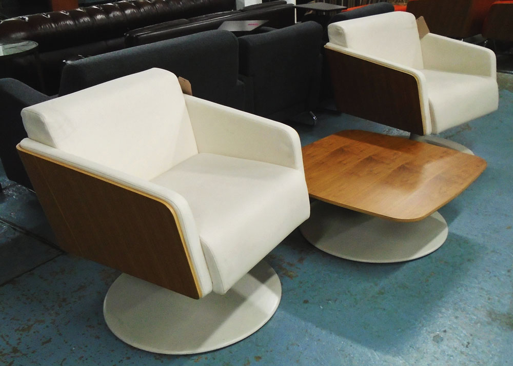 SWIVEL CHAIRS, a pair, cream leather by Krueger International range 'Lyra' and low table to match,