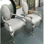 DINING CHAIRS, a set of fourteen, in silvered fabric with oval backs on silver painted frames,