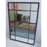 MIRROR, with bevelled plates within a wooden frame, 131cm x 91cm.