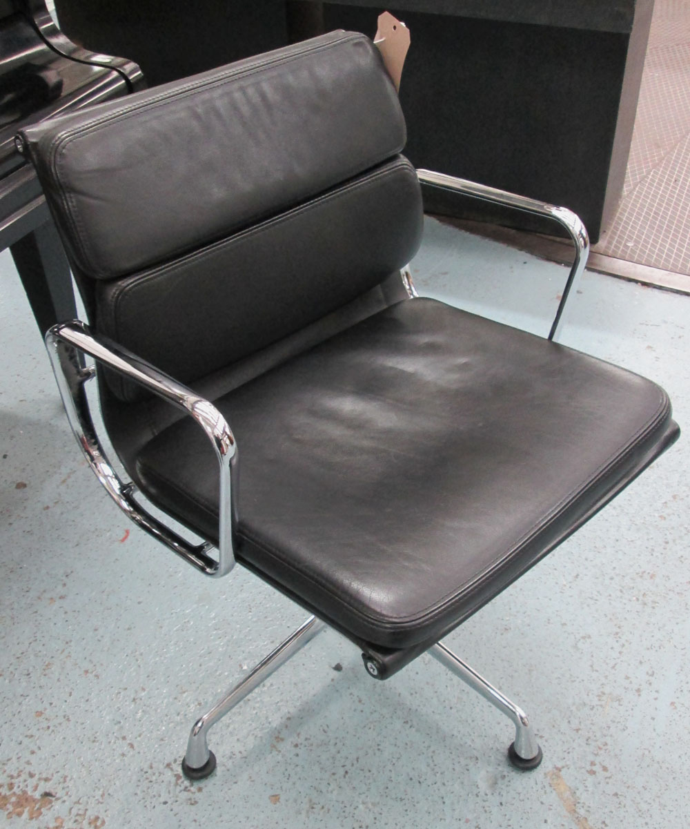 EAMES CHAIR, by Vitra, in black leather on a chromed metal swivel support, label on back and under,