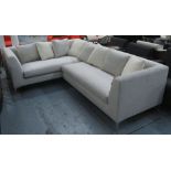 CORNER SOFA, in light grey fabric on chromed metal supports plus eight scatter cushions,