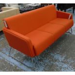 SOFA, by Krueger International range 'Lyra' in orange felt upholstery with tubular metal supports,