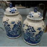 LIDDED JARS, a graduated pair, in Chinese blue and white, 42cm H and 45cm H.