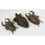 WEST AFRICAN FACE MASKS, three various, carved wooden examples, largest 28cm H.