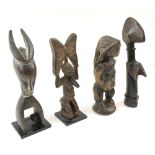 TRIBAL ITEMS, four, comprising a Baule heddle pulley carving, 30.