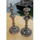 CANDLESTICKS, a pair, Rococo style plated with plugs to top, 39cm H.