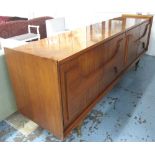 SIDEBOARD, of the 1940's persuasion, on a removable base with tapered feet capped in brass,
