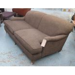 SOFA, Howard style, with brown upholstery on short turned front supports with castors, 195cm L.