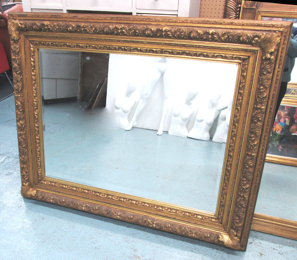WALL MIRROR, gilt frame with a bevelled plate, 137cm W x 114cm H.