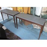 CONSOLE TABLES, a pair, veneered tapered legs with grey marble tops, 110cm L x 40cm W x 72cm H.