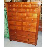 BANK OF DRAWERS, cherrywood with twelve various drawers above a dummy drawer fall front,