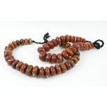 'AFRICAN AMBER' CURRENTLY BEADS TWO STRANDS,