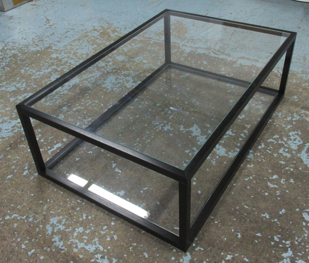 LOW TABLE, the black wooden frame with glass top and undertier, 80cm D x 41cm H x 121cm W.