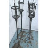 FLOOR STANDING CANDLE LANTERNS, a set of four, vintage style, in metal with removable glass inserts,