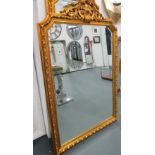 MIRROR, with bevelled plate, Louis XV style, in ornate gilded frame, 167cm x 113cm.