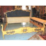 KINGSIZE BED, Italian carved giltwood and polychrome with button upholstered headboard,