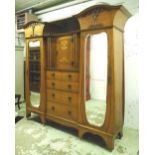 WARDROBE, Art Nouveau, oak, with carved detail and two shaped and bevelled mirrored doors,