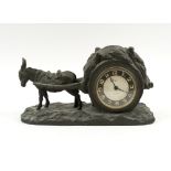 MANTEL TIMEPIECE, early 20th century modelled in the form of a donkey pulling a haycart,