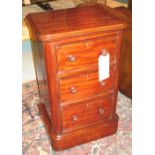 BEDSIDE CHESTS, a pair, Victorian mahogany each with three drawers and plinth base,