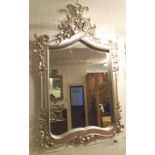 WALL MIRROR, silvered frame with carved detail, 83cm W x 130cm H.