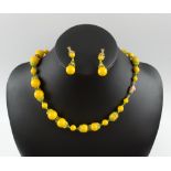 VENDOME YELLOW BEAD NECKLACE AND EARRINGS set with peridot coloured rhinestones, signed Vendome.