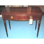 BOWFRONT WRITING TABLE, George III flame mahogany with single frieze drawer,