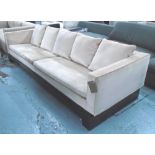 SOFA, of large proportions, with detachable cover and fine cushioned back on plinth base,