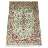 EXTREMELY FINE SIGNED SILK HEREKE RUG, 150cm x 103cm, pole medallion on a jade field of flowerheads,