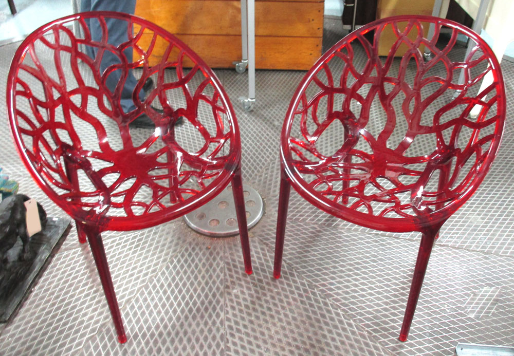 CHAIRS, a pair, contemporary in red intricate naturalistic cut out design, 60cm W.