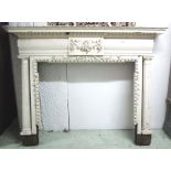 FIRE SURROUND, late Victorian white painted with floral garland tablet flanked by fluted columns.