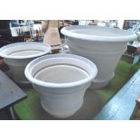 LARGE PLANTER, fibre glass, in a grey finish, 180cm H, and two smaller planters, each 80cm H.