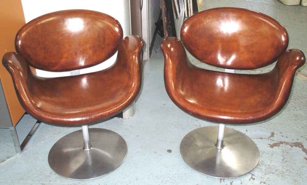 REVOLVING TUB CHAIRS, a pair, 'tulip' shaped, tan brown leather,