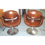 REVOLVING TUB CHAIRS, a pair, 'tulip' shaped, tan brown leather,